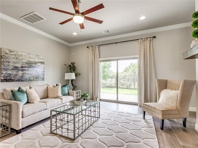 Sliding doors connect to covered patio