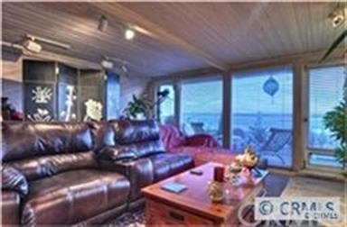 Third Floor Living Area Leading to Private Balcony