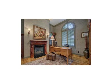 Private office with fireplace, hardwood, floors, b