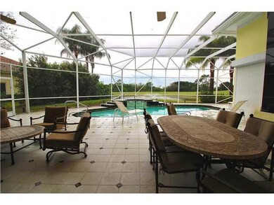 Exterior Front. living room looking out to pool wi