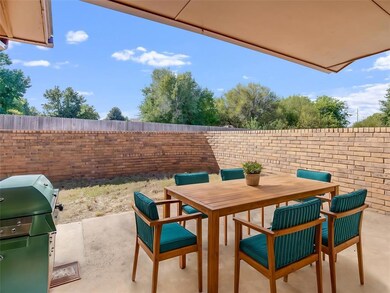 Beautiful back patio with a brick wall.