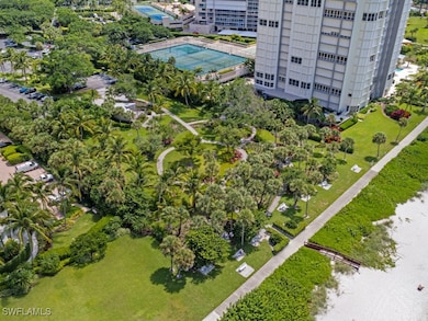 Bird's eye view of a pool, a tree filled landscape