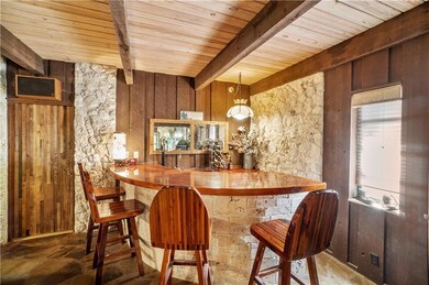 Wet bar with wooden countertop