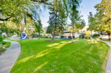 View of home's community with a gazebo and a lawn