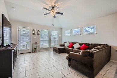 Living area featuring lofted ceiling, a healthy a