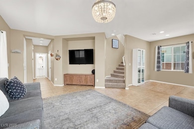 Living area featuring light tile patterned floors,