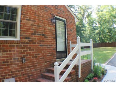 Side entrance to home through laundry area.