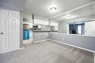 The kitchen features a breakfast bar, new applianc