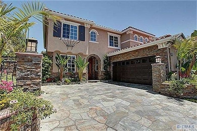 Note stone work around exterior and slate driveway