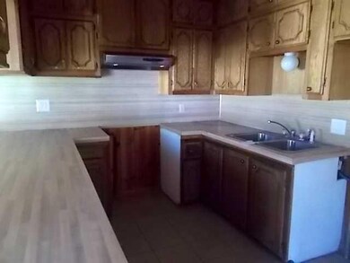 Kitchen. U-shaped kitchen with ceramic tile floors