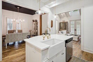 Kitchen, dining and living with vaulted ceilings and fireplace
