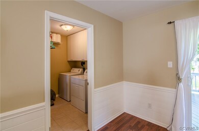 Walk-in laundry room with Ceramic tile floors, and