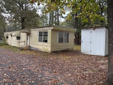 Front of home with storage building