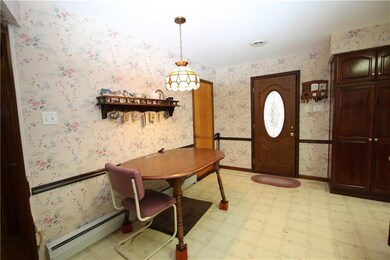 Large Dining area in Open Kitchen. Door Leads to 1