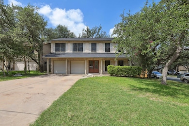 View of front facade with a front yard, concrete 