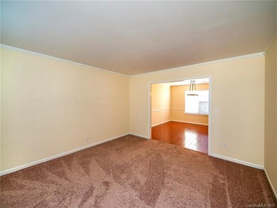 Sitting room with new paint and carpet located jus