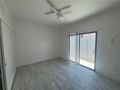 Empty room featuring wood finished floors, a ceili