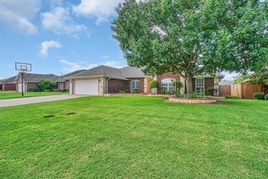 Single story home featuring an attached garage, driveway, brick siding, and a shingled roof