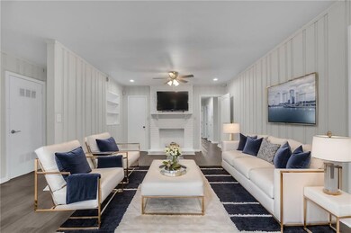 Living area featuring visible vents, a fireplace, 