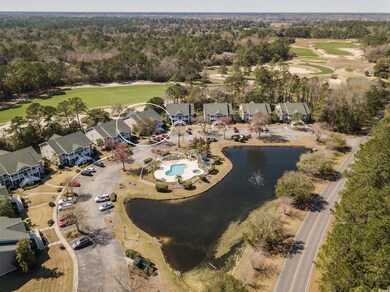 Birds eye view of property with golf course view a