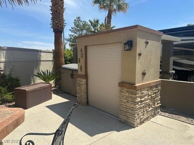 View of outbuilding featuring fence
