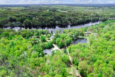 Hovering over the lot looking back down Riverview Dr towards the Menominee River.