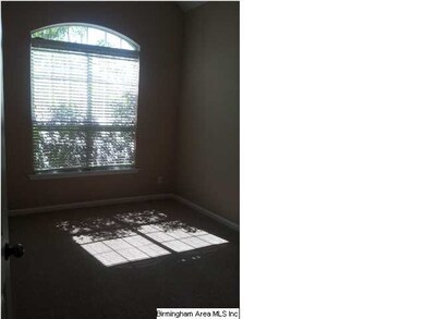 2nd Bedroom with Large Window and Vaulted Ceiling