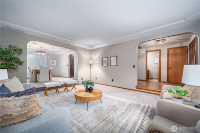 Another view showcasing the inviting entryway and formal dining room.