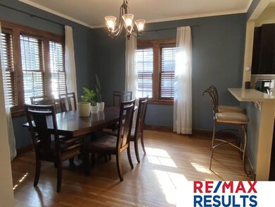 Open dining space.  Wood flooring ad enchanting lighting.