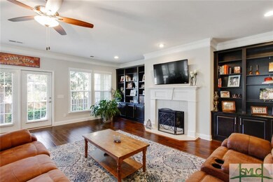 Another view of this living space shows ample ligh