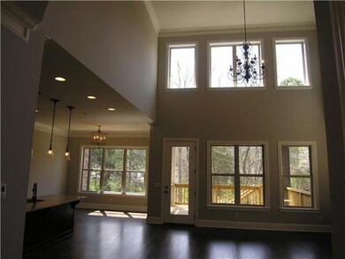 2-Story Family room, looks above & below, the covered rear deck.