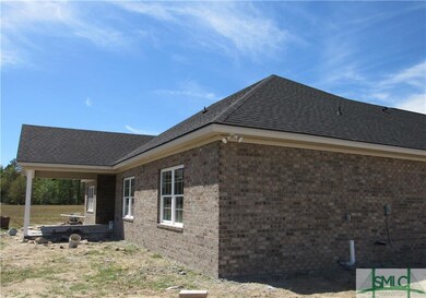 All sides brick, covered back porch