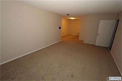 Living Room with new carpet and paint.  Add furnit
