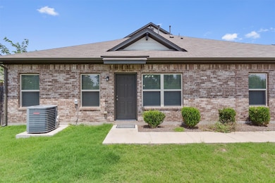 View of front of home with central AC, a shingled