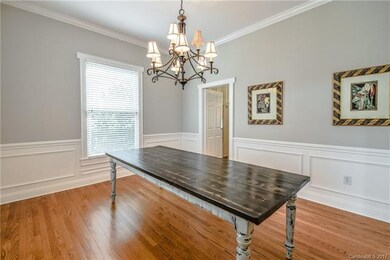 Dining Room with Classic Wainscoting & Butler Door
