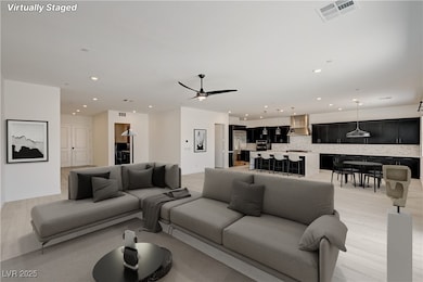 Living area featuring recessed lighting, light woo