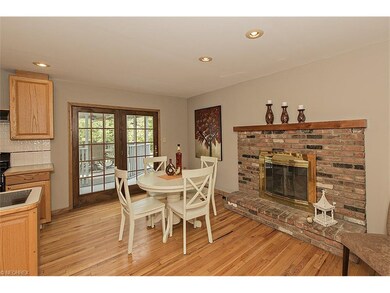 Charming Dinette area with fireplace and doors to 