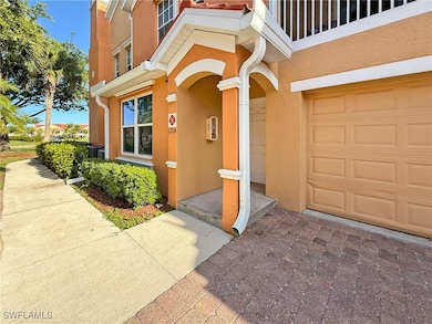 Entrance to property with stucco siding