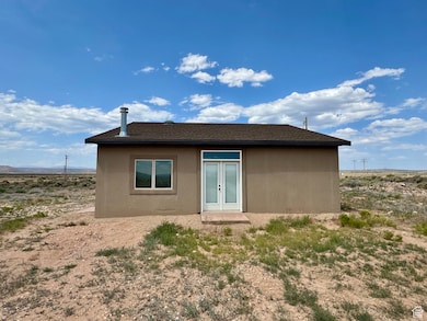 Back of house with stucco siding