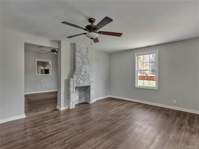Front living area with new flooring, painted stone