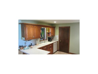 Kitchen area with peninsula serving counter and oa