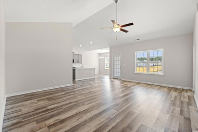 Unfurnished living room featuring light wood-style
