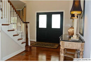 Welcoming two story foyer.  Gleaming hardwood in t
