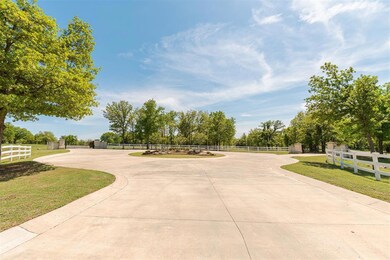 View of property's community featuring a fenced front yard, a gate, and a lawn