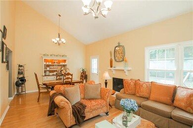 Large living room/dining room combination - soaring ceiling and lots of light, gas fireplace.  