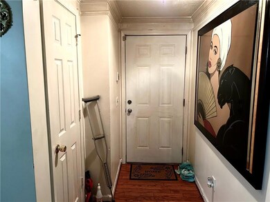 Entryway with hardwood / wood-style flooring and c