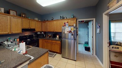 Kitchen and Laundry/Storage behind it