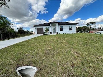 View of front of property with a garage and a fron