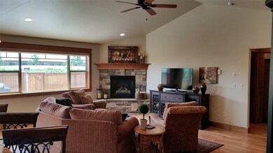 Vaulted LR and Attractive Stone Fireplace and Mant