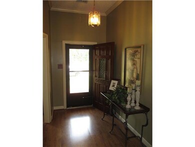 Gleaming wood floors in entry and throughout.  Hig